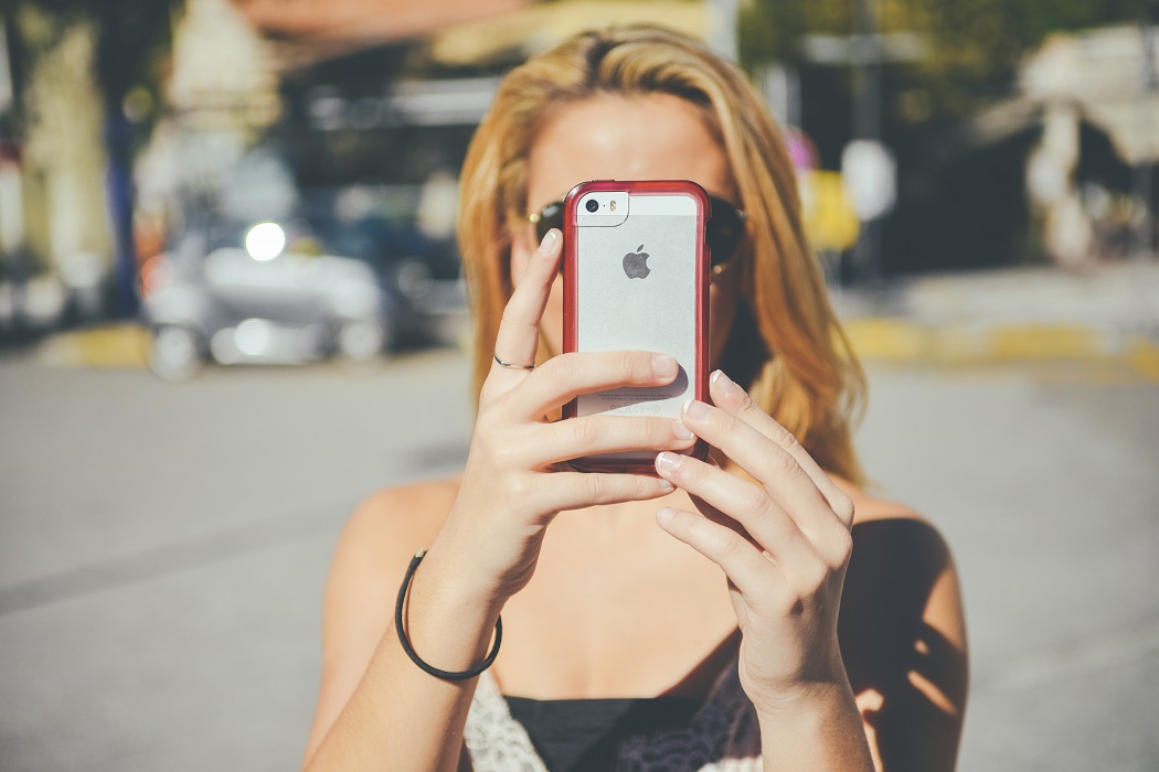 woman taking selfie in glasses