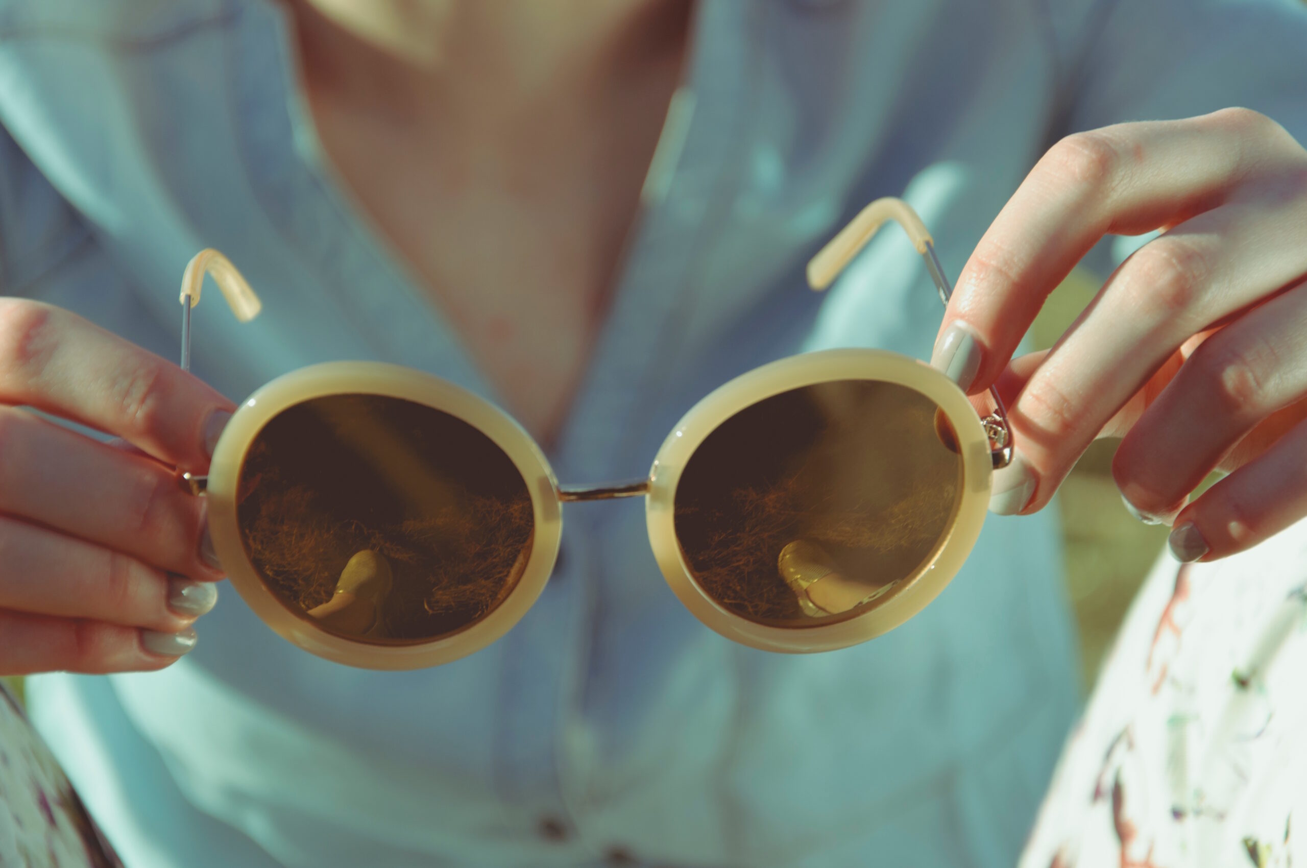 sunglasses and blue nailpolish